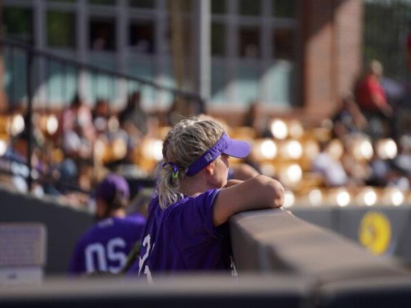 softball player in a dugout