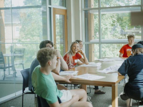 a group of people sitting at a table