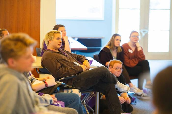 a group of people sitting in a room